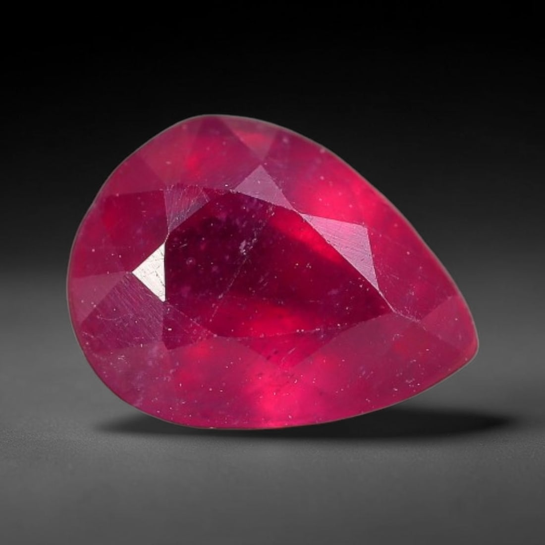 1.40 Carats Natural Madagascar Vivid Fuchsia Red Heated Ruby Loose Gemstone, 24FM: This vivid fuchsia red Madagascar ruby displays rich saturated red tone with subtle natural internal mineral traces that showcase genuine earth-grown character, measured at 7.6x5.8x3.8mm, the intense 