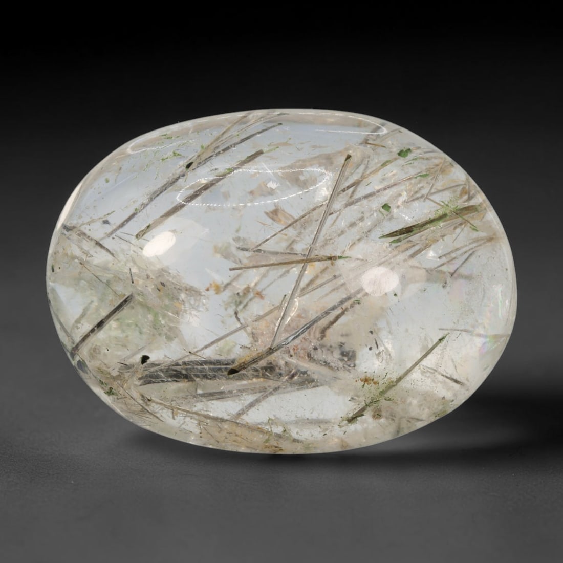 25ct Natural Brazilian Black Rutile Quartz Cabochon Loose Gemstone, 43BM: This polished cabochon of natural rutile quartz features countless distinct slender black rutile needle inclusions suspended within the clear quartz host crystal. The smooth domed surface enables full