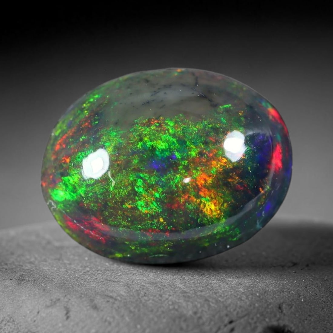 2.10ct Natural Ethiopian Welo Black Smoked Opal Cabochon Loose Gemstone, 30FX: This fully polished Ethiopian Welo opal features a dark smoked base with vivid, sweeping play-of-color shifting across its glossy dome surface, measured at 11x8x4mm. The black smoke treatment deepens 