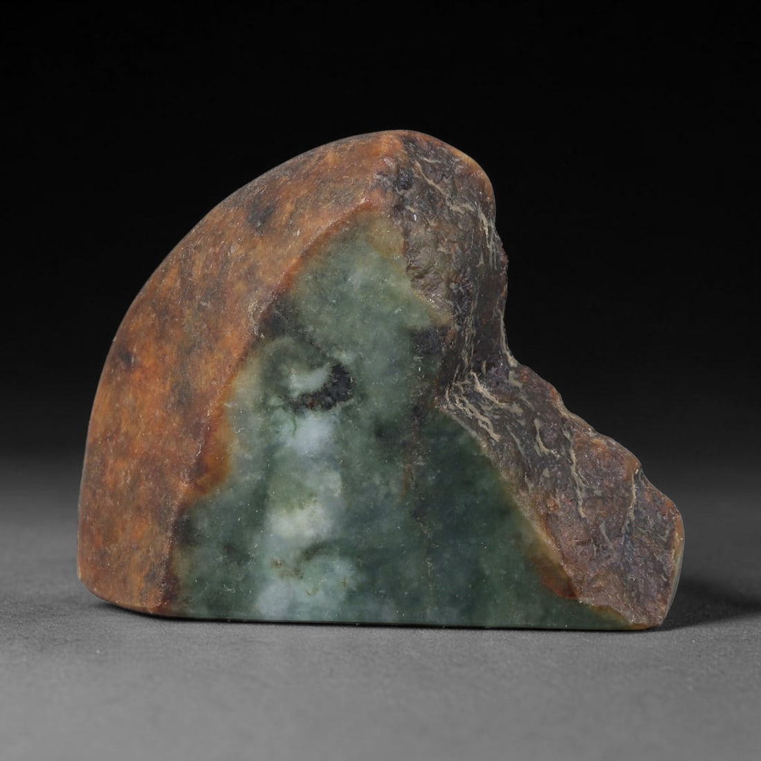 370ct Natural Type A Burmese Jadeite Jade Sliced Rough, 53FD: This specimen is a sliced rough block of natural Type A Burmese jadeite jade. The interior displays natural colour zoning with visible mineral veining and crystalline patterns typical of unprocessed j