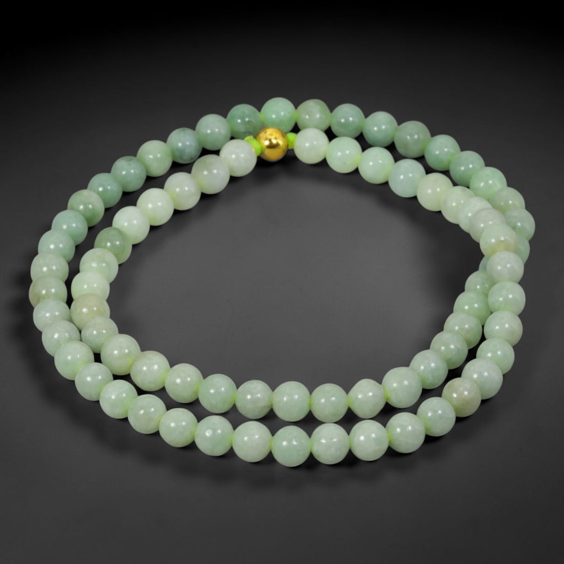 Natural Burmese Type A Jadeite Jade Round Bead Necklace with Gold Gilt Accent Bead, 9BL: Elegant hand-strung necklace made from polished natural untreated Burmese Type A jadeite jade spherical beads, each bead measuring 8 mm in diameter. The jadeite features a soft pale milky celadon hue 