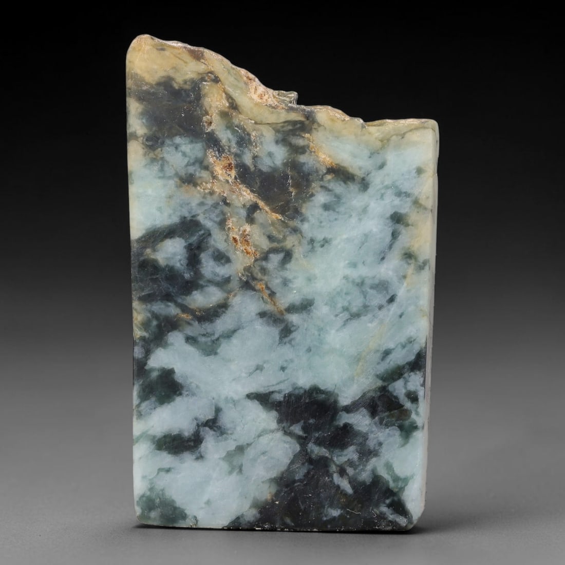 295ct Natural Type A Burmese Jadeite Jade Sliced Rough, 4FB: This specimen is a sliced rough block of natural Type A Burmese jadeite jade. The interior displays natural colour zoning with visible mineral veining and crystalline patterns typical of unprocessed j