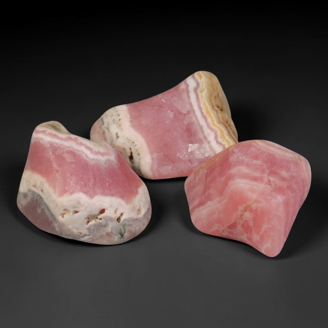 81ct 3pcs Natural Argentine Rhodochrosite Banded Tumbled Rough Set, 6FD: This listing features three individual tumbled rhodochrosite rough pieces sourced from Argentina Capillitas deposits, each showcasing distinct layered banding of soft rose pink, cream white and pale t