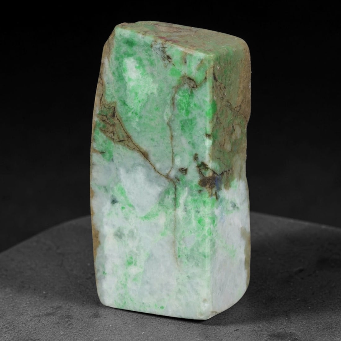 340ct Natural Type A Burmese Jadeite Jade Sliced Rough, 97FA: This specimen is a sliced rough block of natural Type A Burmese jadeite jade. The interior displays natural colour zoning with visible mineral veining and crystalline patterns typical of unprocessed j