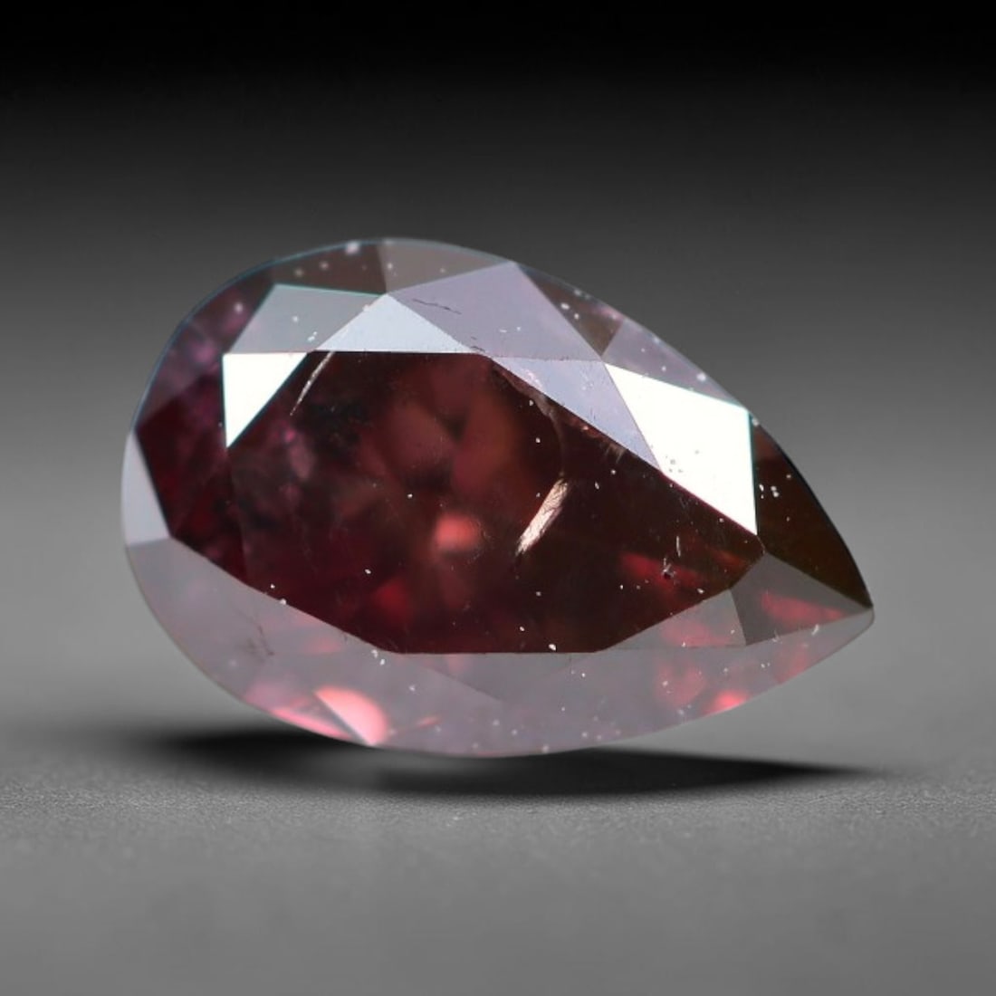 0.31ct Natural Fancy Pinkish Purple Diamond Loose Gemstone, 20BH: This polished natural diamond displays rich pinkish-purple body saturation, with subtle fine microscopic mineral specks distributed within its crystal interior, measured at calibrated dimensions of 5.