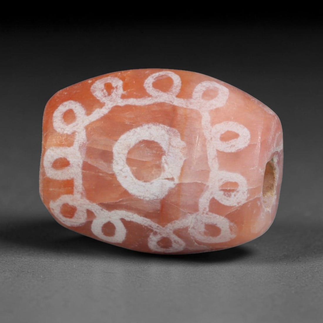Antique Sino-Himalayan Region Etched Carnelian Bead, 96EG: Antique etched carnelian bead originating from the Sino-Himalayan region. Exhibits characteristic surface patina and traditional etched white decoration. Dimensions: 14x11mm, fully pierced for suspens
