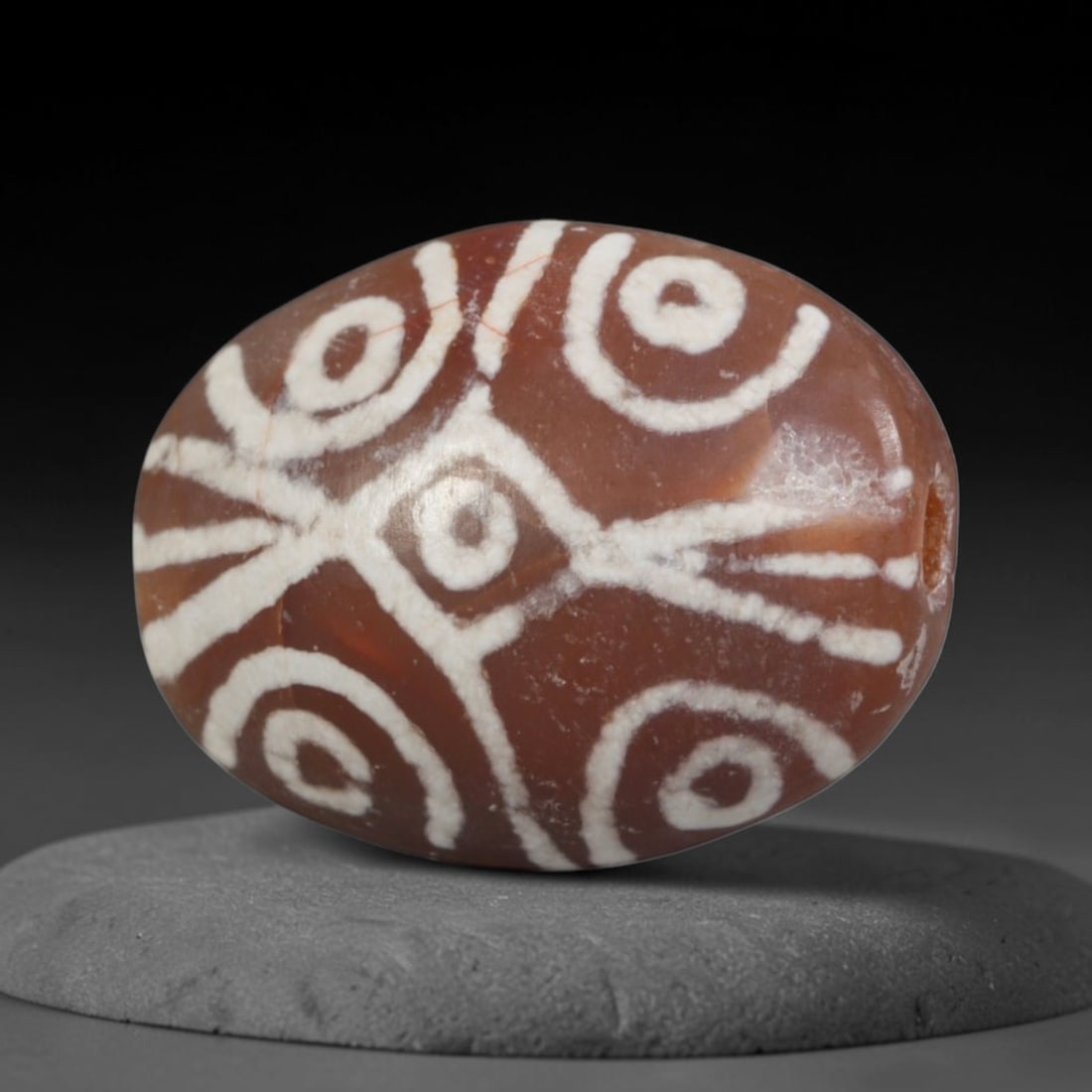 Antique Sino-Himalayan Region Etched Carnelian Bead, 94EG: Antique etched carnelian bead originating from the Sino-Himalayan region. Exhibits characteristic surface patina and traditional etched white decoration. Dimensions: 15x12mm, fully pierced for suspens