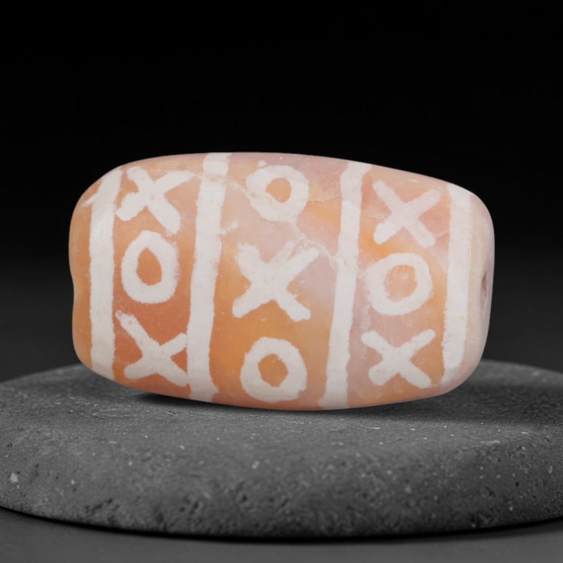 Antique Sino-Himalayan Region Etched Carnelian Bead, 88EG: Antique etched carnelian bead originating from the Sino-Himalayan region. Exhibits characteristic surface patina and traditional etched white decoration. Dimensions: 16x9mm, fully pierced for suspensi