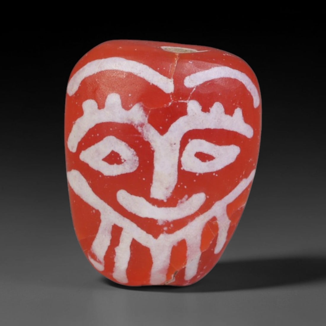 Antique Sino-Himalayan Region Etched Carnelian Bead, 98EG: Antique etched carnelian bead originating from the Sino-Himalayan region. Exhibits characteristic surface patina and traditional etched white decoration. Dimensions: 12x9mm, fully pierced for suspensi