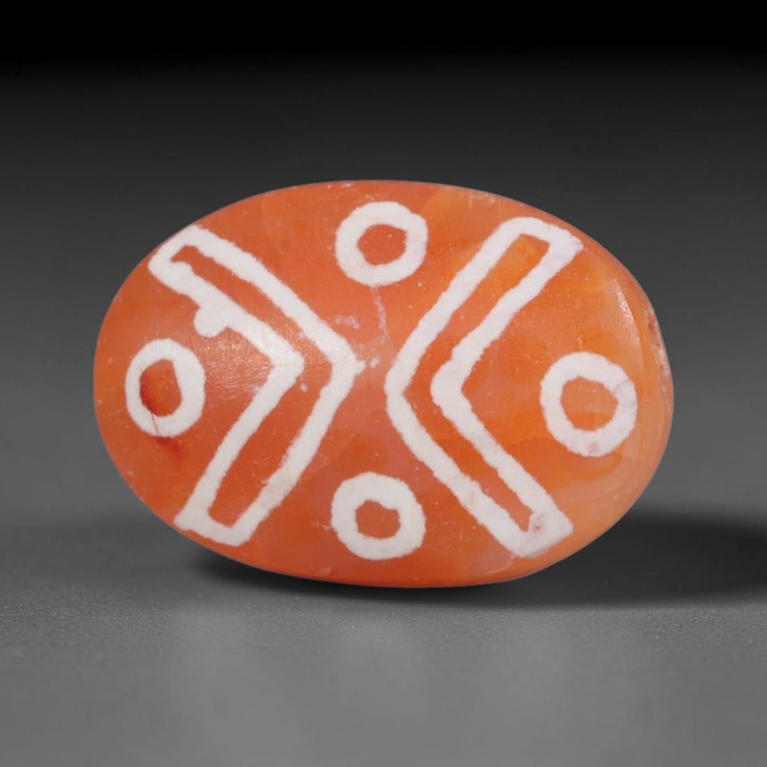 Antique Sino-Himalayan Region Etched Carnelian Bead, 95EG: Antique etched carnelian bead originating from the Sino-Himalayan region. Exhibits characteristic surface patina and traditional etched white decoration. Dimensions: 16x11mm, fully pierced for suspens