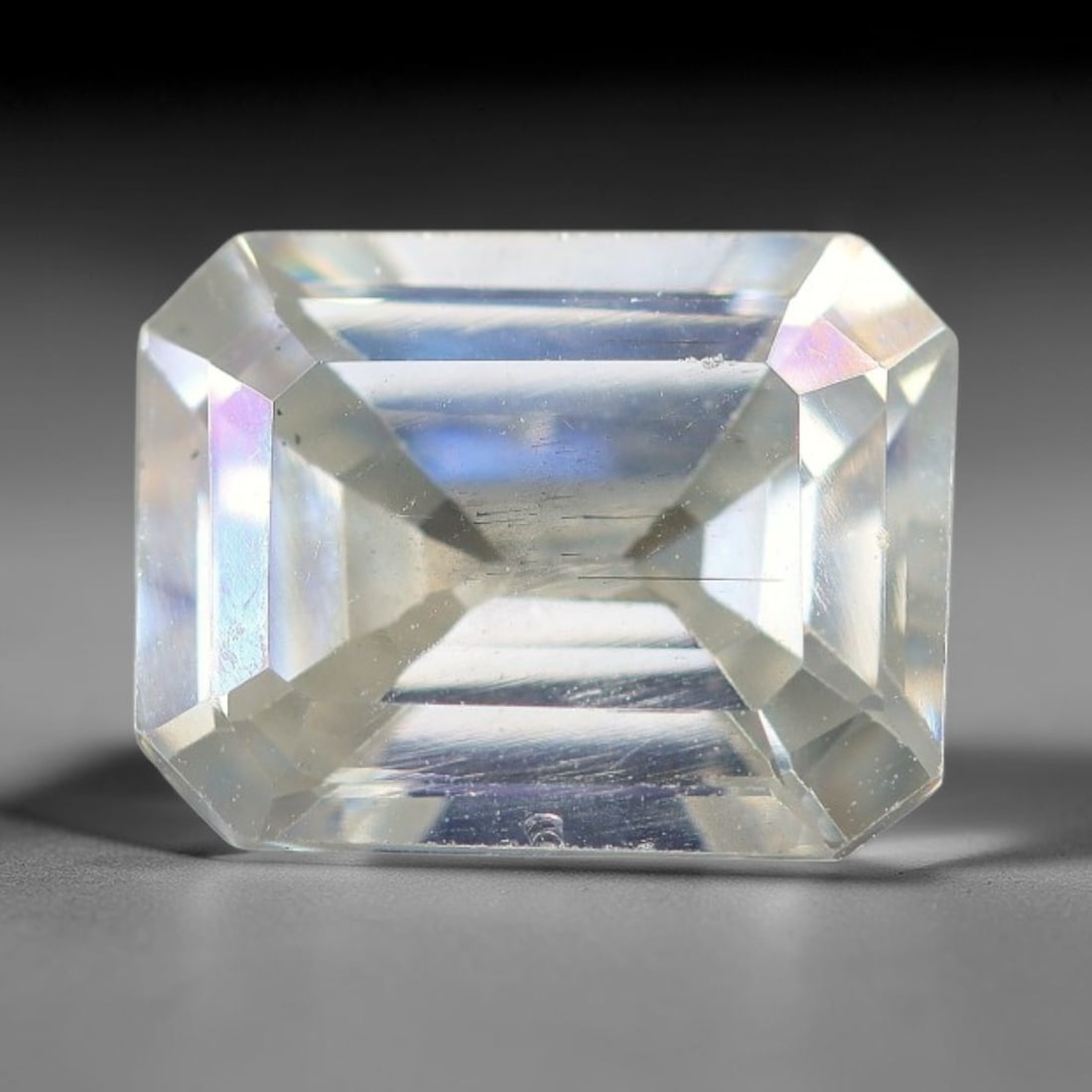 1.46 Carats Natural Cool White Moissanite Loose Gemstone, 98FM: This cool white moissanite holds dimension measurements of 8.1x6.2x3.6mm, delivering exceptional light dispersion that generates vivid rainbow sparkle across its fully transparent body, with faint mic