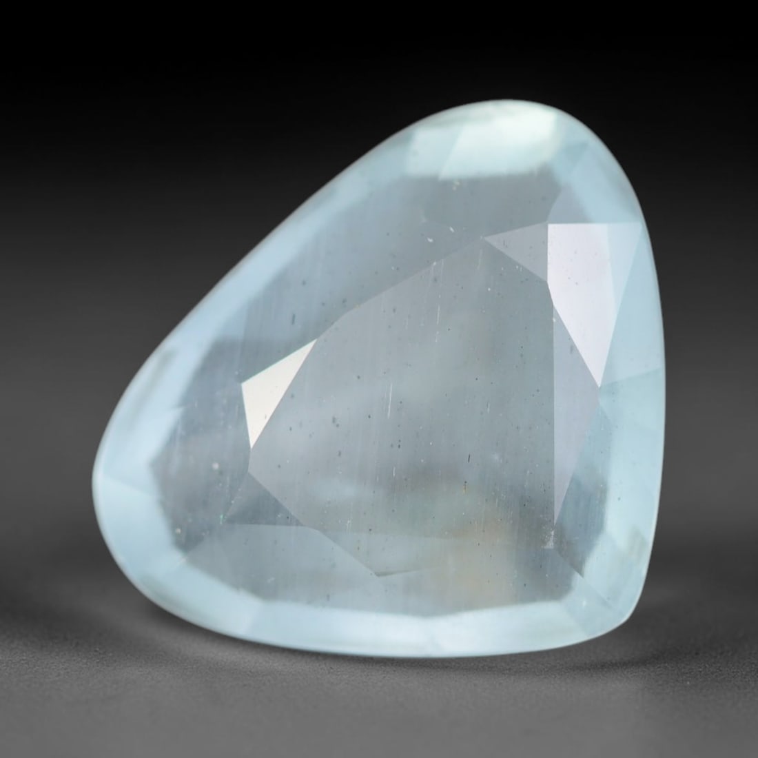 3.97ct Natural Brazilian Soft Sky Blue Faceted Aquamarine Loose Gemstone, 13AS: This expertly faceted aquamarine carries a gentle soft sky blue translucent body with faint fine natural internal mineral markings visible through its polished reflective facets within its 13.6x11.2x4