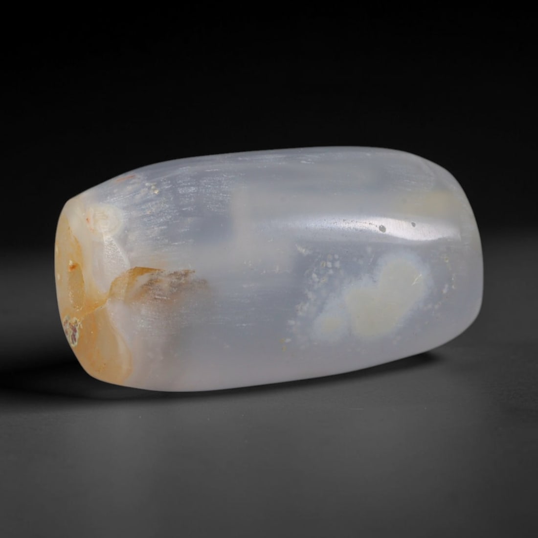 Ancient Median Empire Banded Agate Barrel Bead (678-549 BCE), 59AD: This antique banded agate barrel bead originates from the Median Empire, a formative Iranian plateau civilization with accomplished lapidary traditions creating agate talismans and elite adornment tra