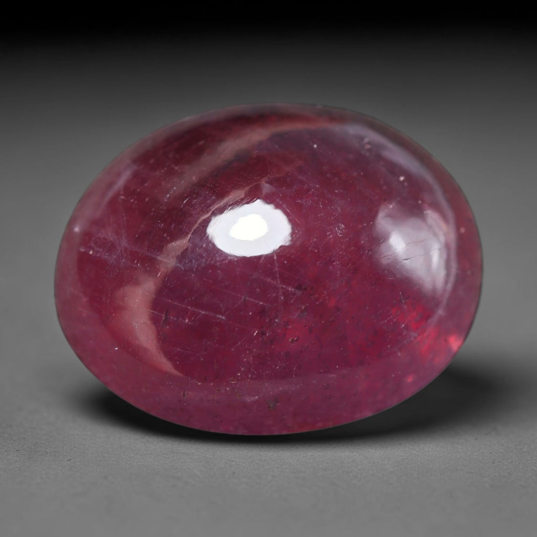 17.44ct Natural Madagascar Ruby Oval Cabochon Loose Gemstone, 74BY: This smoothly polished oval cabochon is natural ruby originating from Madagascar. It exhibits rich deep red colouration throughout the crystal matrix, with visible natural mineral veining, fine crysta