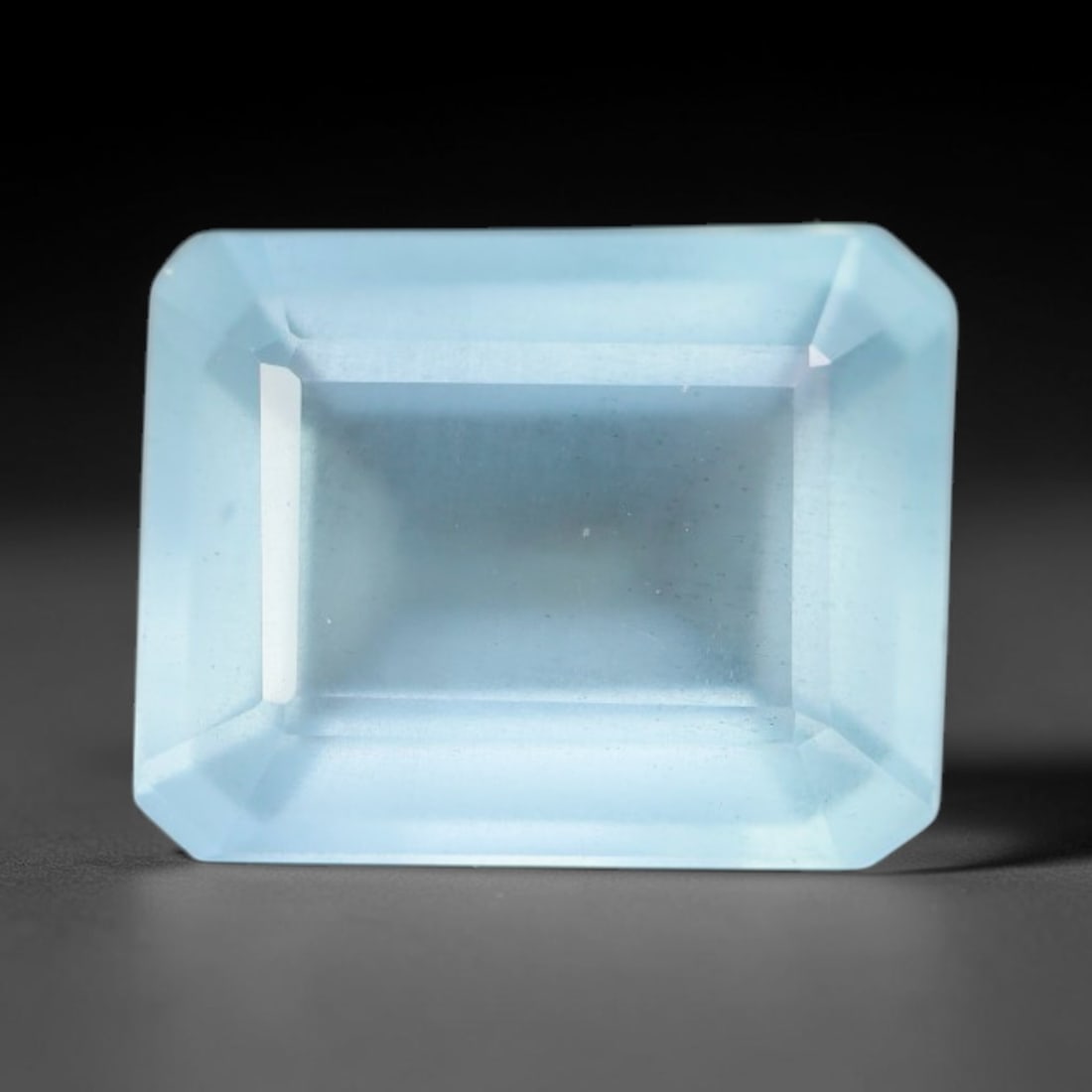 2.07ct Natural Brazilian Soft Sky Blue Faceted Aquamarine Loose Gemstone, 11AS: This expertly faceted aquamarine carries a gentle soft sky blue translucent body with faint fine natural internal mineral markings visible through its polished reflective facets within its 9x7.2x4.1mm