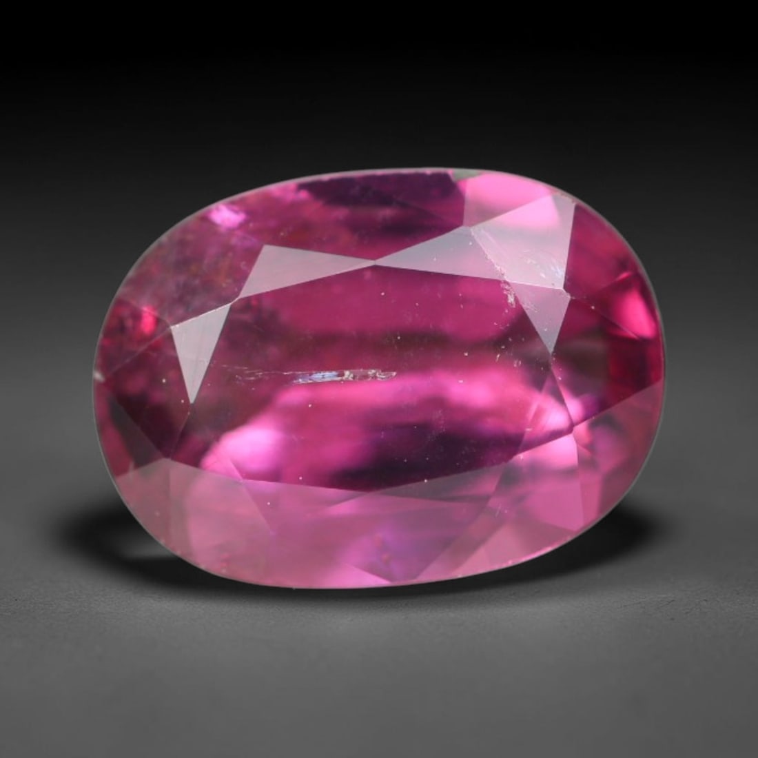 1.56ct Natural Tanzanian Rhodolite Grape Garnet Faceted Loose Gemstone, 98BA: This expertly faceted grape garnet, a scarce saturated purple-magenta rhodolite variant, features transparent crystal structure dotted with faint microscopic mineral specks within its precisely cut re