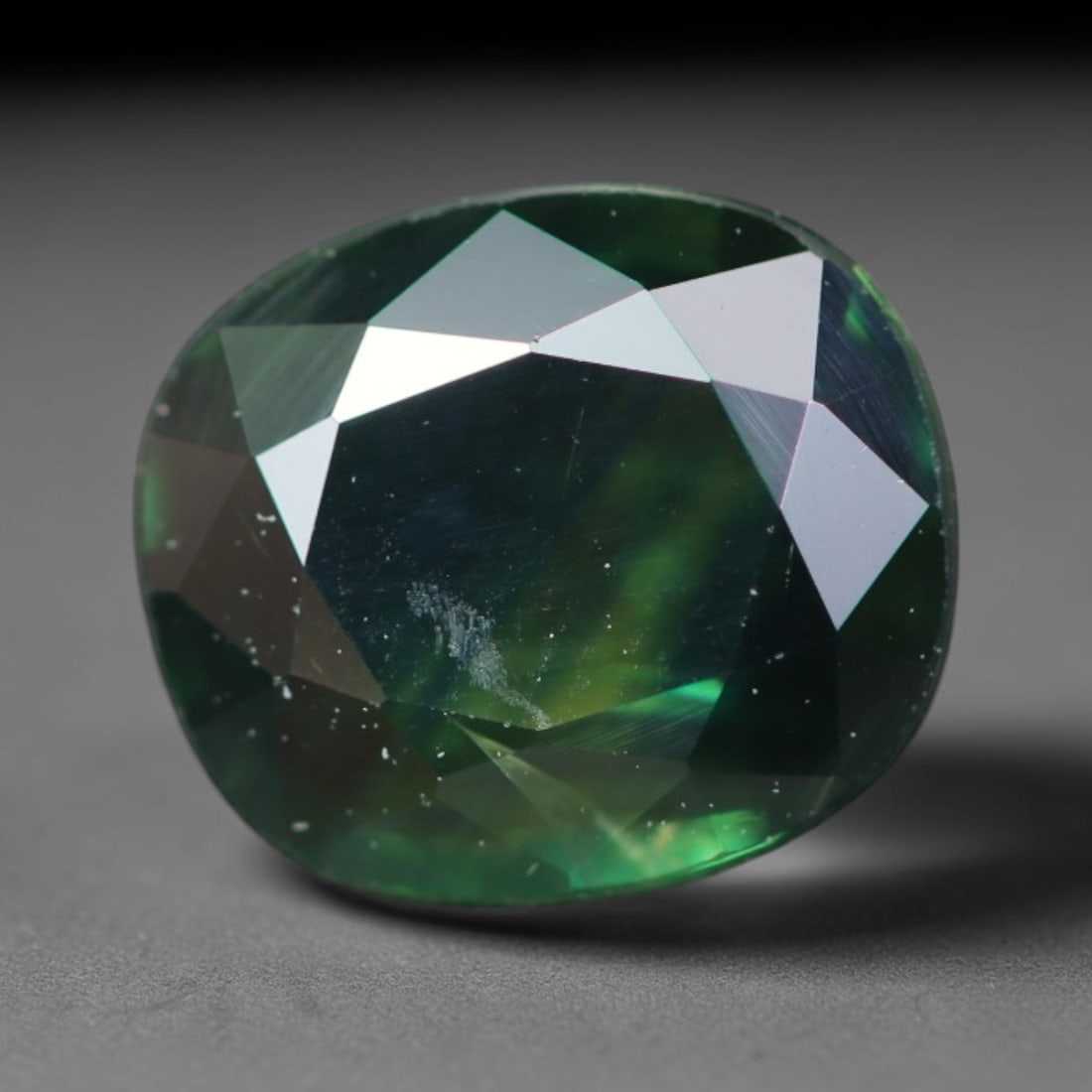 1.70ct Natural Australian Teal Faceted Sapphire Loose Gemstone, 3BA: This skillfully faceted sapphire features rich saturated body tone with fine microscopic mineral inclusions scattered evenly across its polished reflective planes within its 7.6x6.5x3.1mm calibrated d