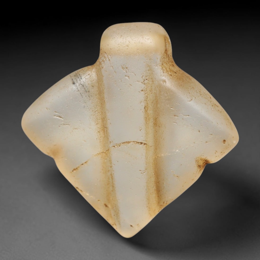 Ancient Medieval Coptic Christian Egyptian Culture Rock Crystal Amulet (300-1000 CE), 26FY: This antique rock crystal amulet originates from Coptic Christian Egyptian Culture, a region with a long-standing tradition of crafting translucent hardstone talismans for devotional and funerary use.