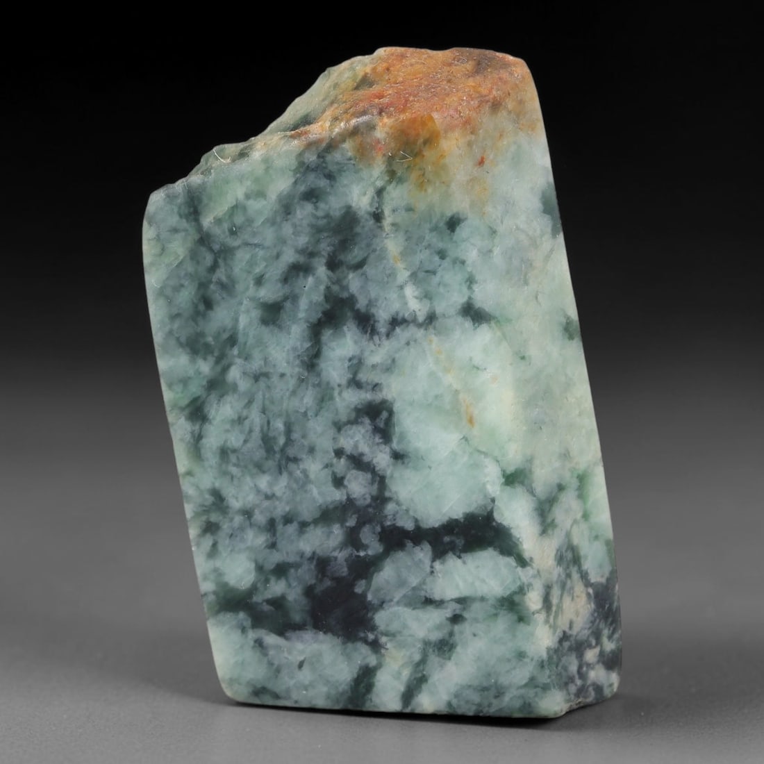 261ct Natural Type A Burmese Jadeite Jade Sliced Rough, 8FB: This specimen is a sliced rough block of natural Type A Burmese jadeite jade. The interior displays natural colour zoning with visible mineral veining and crystalline patterns typical of unprocessed j