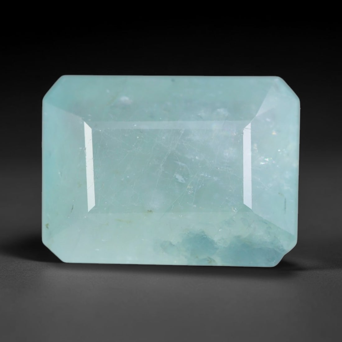 5.59ct Natural Madagascan Faceted Grandidierite Rare Loose Gemstone, 100AS: This expertly faceted finished grandidierite holds soft translucent body tone with fine faint natural internal veining visible beneath precisely cut reflective facets within its 13.5x10x5.1mm calibrat