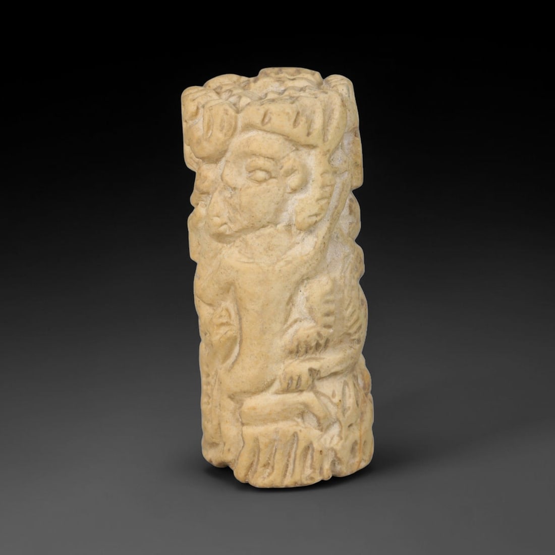 Ancient Mesopotamian Stone Cylinder Relief (c.2300-539 BCE), 73EF: This carved pale stone cylinder relief originates from Ancient Mesopotamia. The exterior bears densely modelled figural relief work encircling the cylindrical form, rendered in characteristic regional