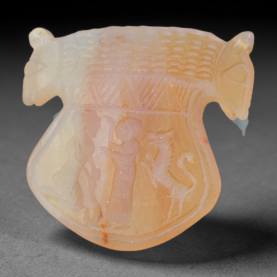 Vintage Natural Carnelian Agate Revival Indo-Persian Glyptic Figural Talisman Amulet Plaque, 47FK: This vintage talisman pendant plaque is skillfully carved from natural banded carnelian agate, crafted in a style referencing ancient Indo-Persian glyptic art traditions. The face bears detailed relie
