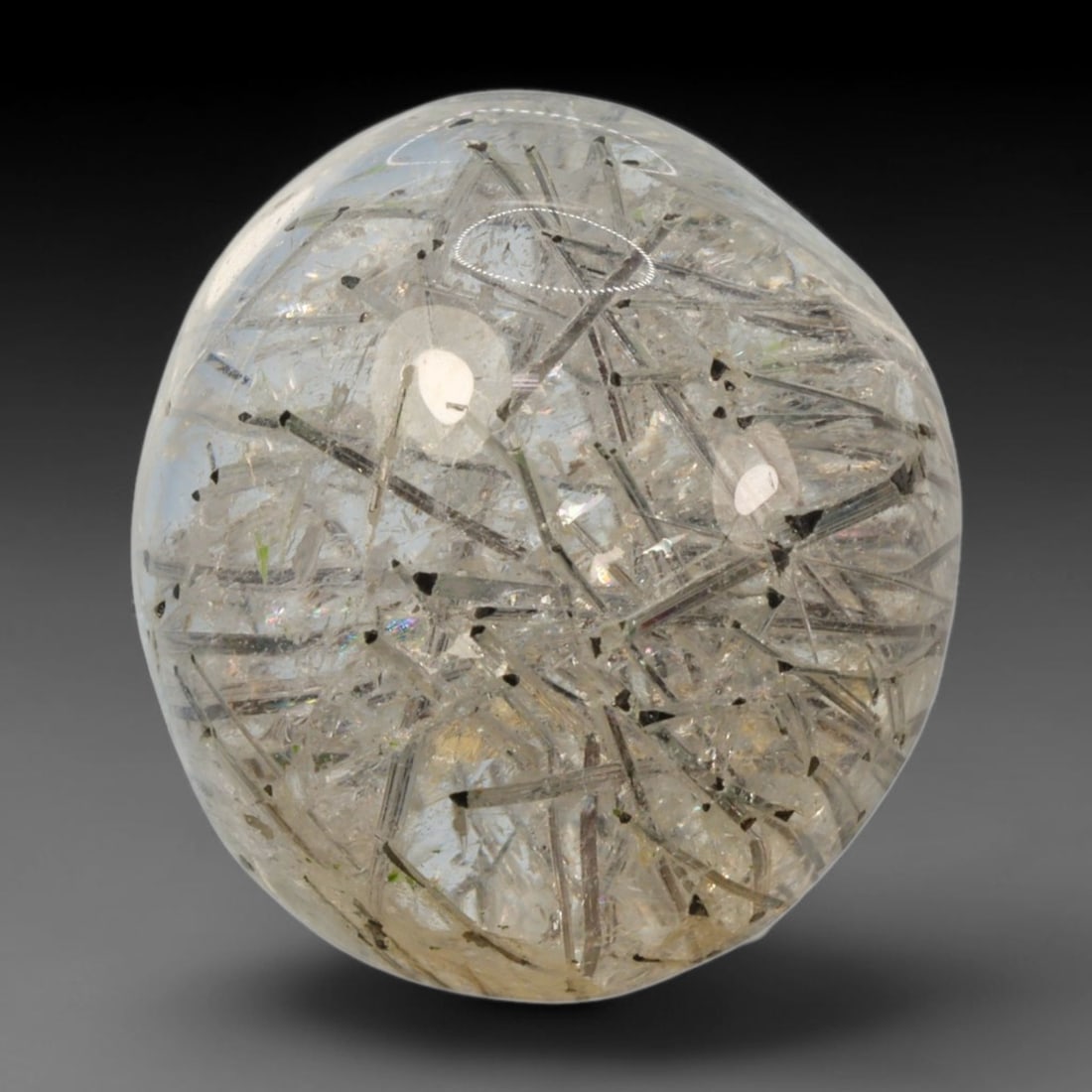 15ct Natural Brazilian Black Rutile Quartz Cabochon Loose Gemstone, 72BM: This polished cabochon of natural rutile quartz features countless distinct slender black rutile needle inclusions suspended within the clear quartz host crystal. The smooth domed surface enables full