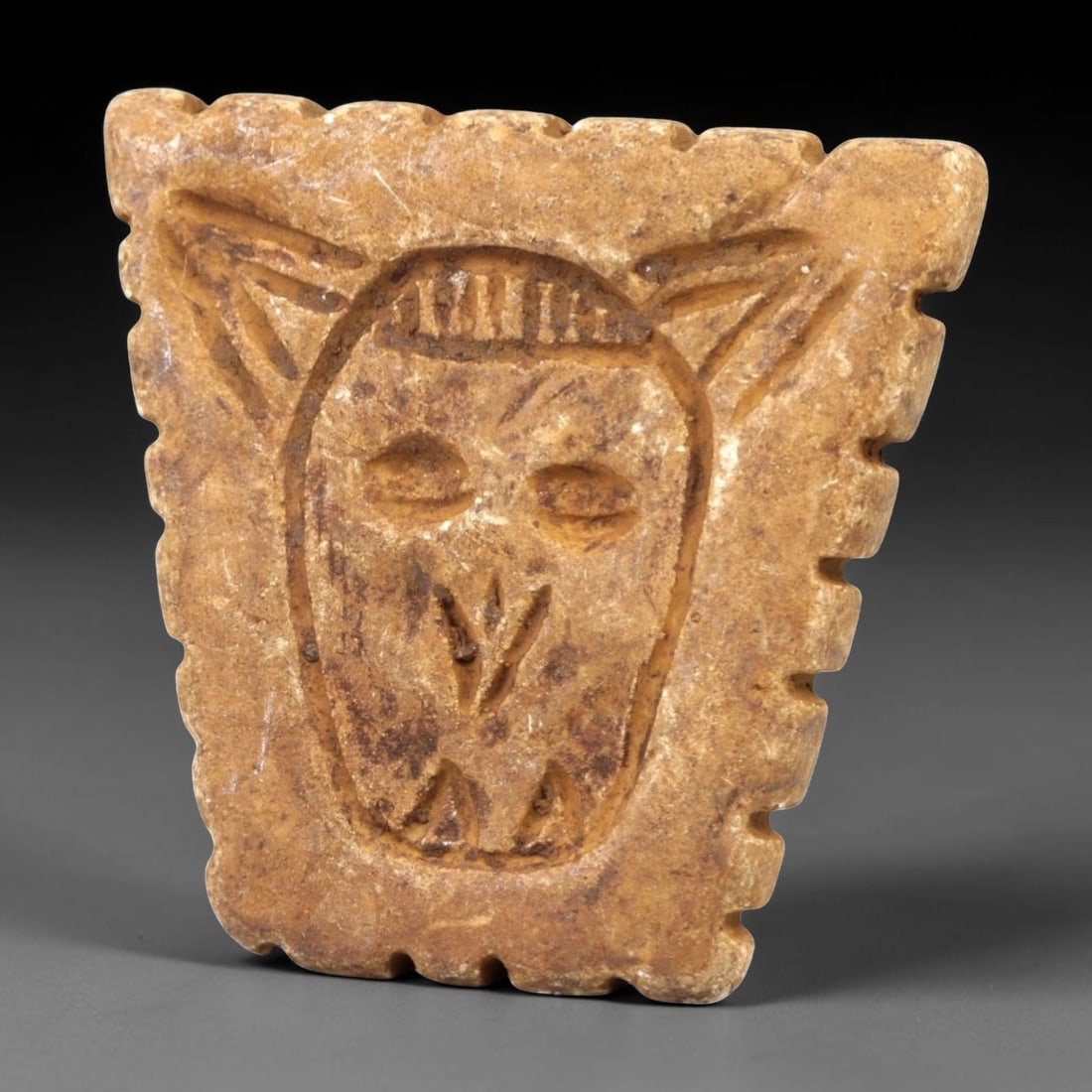 Ancient Stone Stamp Seal - Near Eastern Figurine, 78AL: Carved from tan speckled stone, this stamp seal consists of two distinct components: a rectangular base with incised linear edge detailing and a raised animal-headed finial, likely a bovine or caprid,