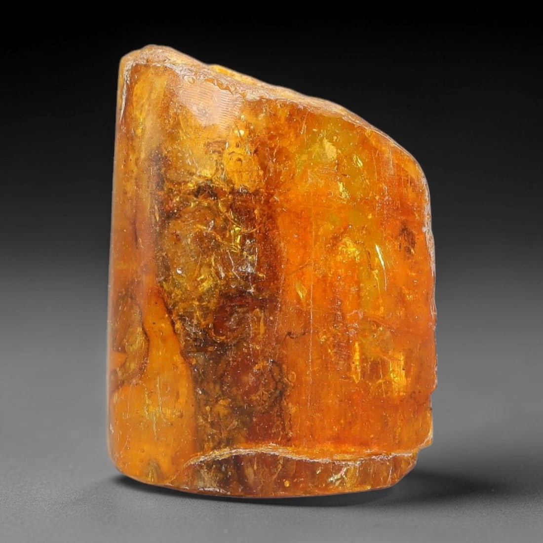 14.83ct Natural Baltic Polished Loose Freeform Amber Gemstone, 32EB: This smoothly polished freeform amber piece carries warm translucent organic clarity with fine natural fossil flecks and tiny mineral inclusions suspended throughout its 21x20mm flowing unstructured s