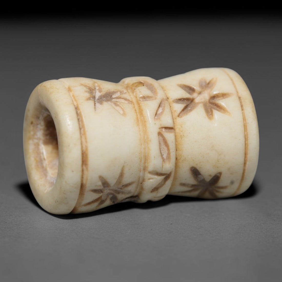 Antique Sino-Siberian Steppe Nomadic Craft Stag Antler Carved Cylinder Bead (Post 1850s), 51FV: Single bead carved from natural stag antler, originating from Sino-Siberian Steppe Nomadic craft traditions, post 1850s. Measuring 2x1cm, the piece features detailed surface carving and carries warm n