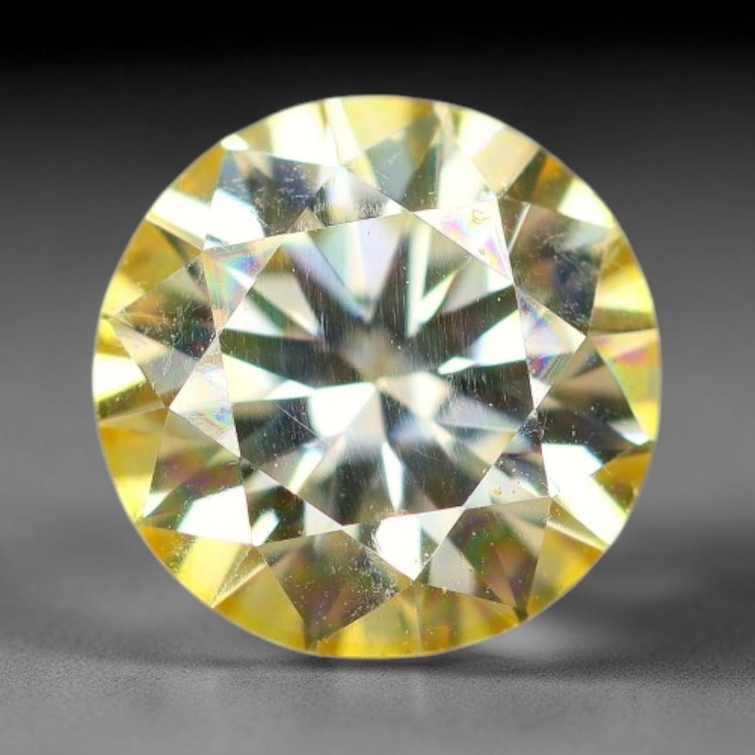0.93 Carats Natural Golden Yellow Moissanite Loose Gemstone, 100FM: This golden yellow moissanite features dimensional measurements of 6.4x3.8mm, lab-crafted silicon carbide boasting extraordinary refractive power that produces intense, multi-tonal rainbow brilliance 