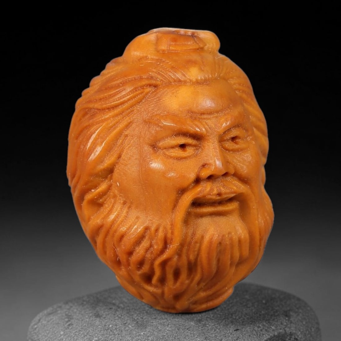 A Chinese Carved Natural Olive Nut Drilled Art Bead, 57BZ: Traditional craft bead carved from solid natural olive nut core, representing a classic miniature Chinese micro-carving folk art piece with a pre-drilled suspension bore integrated for easy threading 
