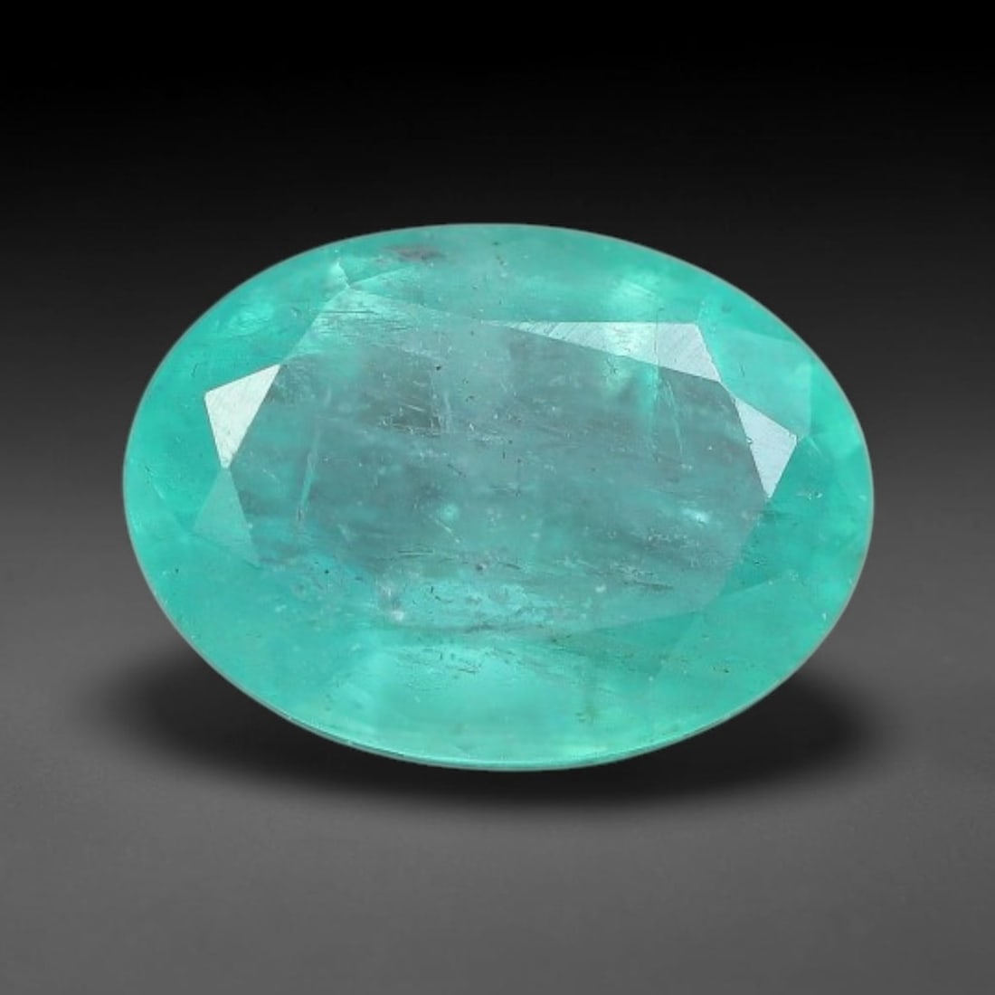 0.82 Carats Natural Zambian Green Emerald Loose Gemstone, 13FP: This green Zambian emerald holds smooth even saturation with subtle faint natural internal markings lending authentic organic character, measured at 7.1x5.1x3.4mm, its calm cool green tone delivers un
