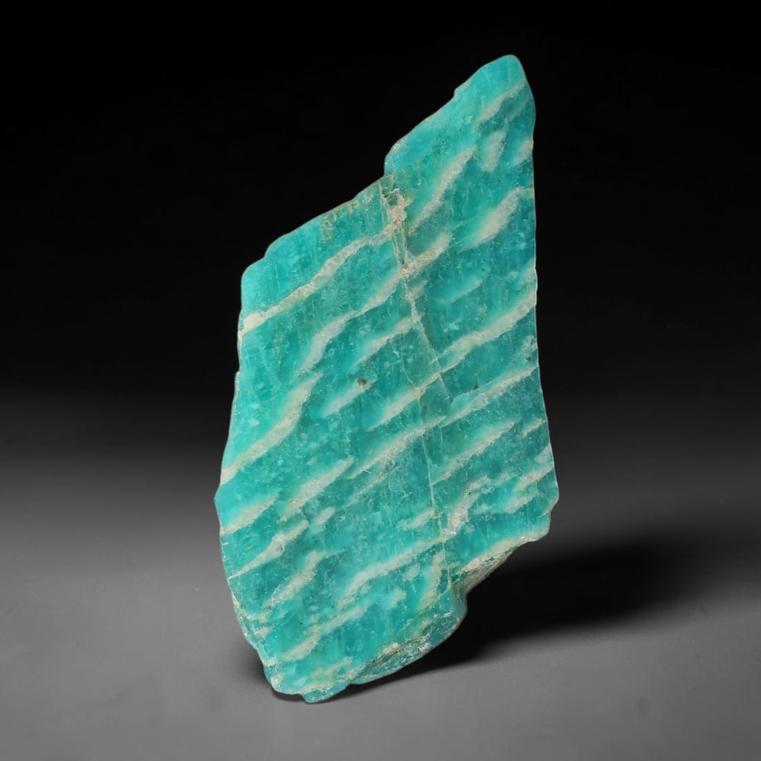 80ct Natural Russian Ural Amazonite Slab Rough, 87EB: This intact amazonite slab features distinct parallel mineral banding running uniformly across its naturally split flat surface within 48x24x11mm slab dimensions, retaining unmodified natural geologic