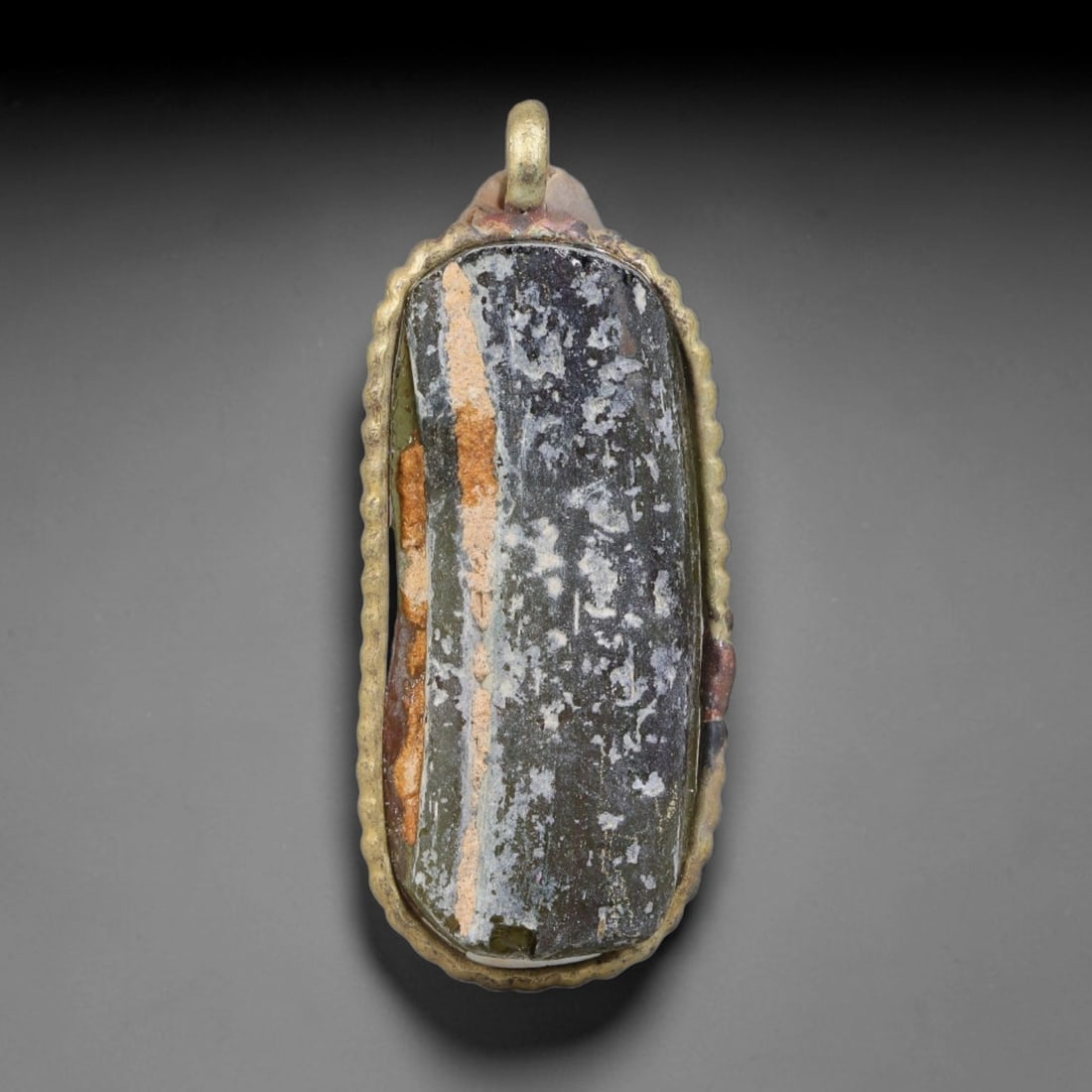 Ancient Roman Glass Slag in Modern Gilt-Edge Pendant, 37EH: This contemporary pendant is crafted from ancient Roman glass slag, featuring a fragmented, iridescent glass surface with weathered patina. The irregular form is bordered by a subtle gilt frame, added