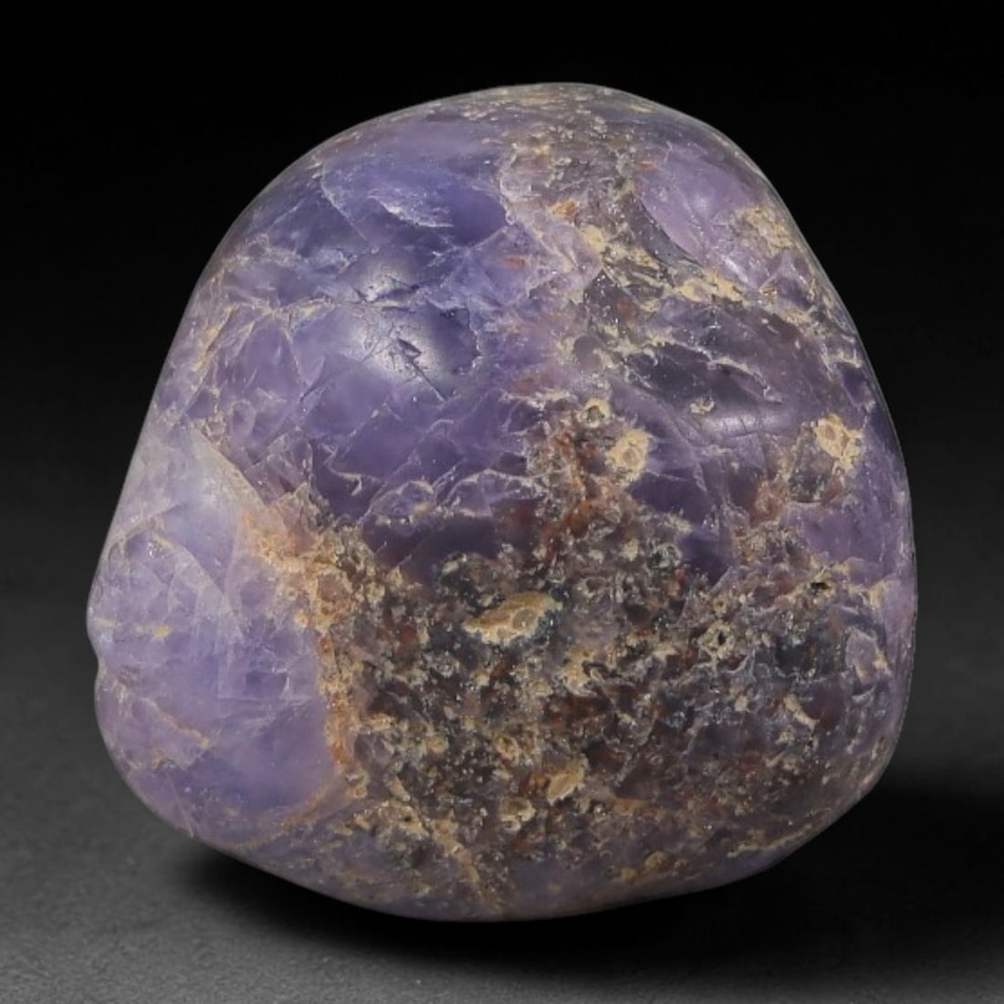 27.58ct Natural Unheated Sri Lankan Purplish Blue Sapphire Rough, 78FC: This natural corundum rough is an unheated purplish blue sapphire sourced from Sri Lankan alluvial gem deposits, featuring an irregular natural native form with residual pale yellow-brown mineral matr