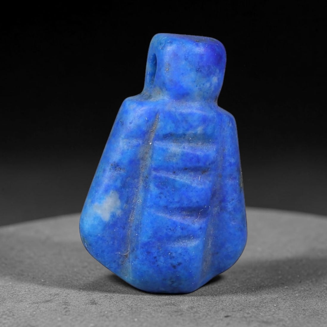 Ancient Medieval Coptic Egyptian Lapis Lazuli Amulet (400-800 CE), 66EG: This antique lapis lazuli amulet originates from Ancient Medieval Coptic Egyptian cultural tradition, created to function as a wearable protective talisman for personal spiritual safeguard. The deepbl