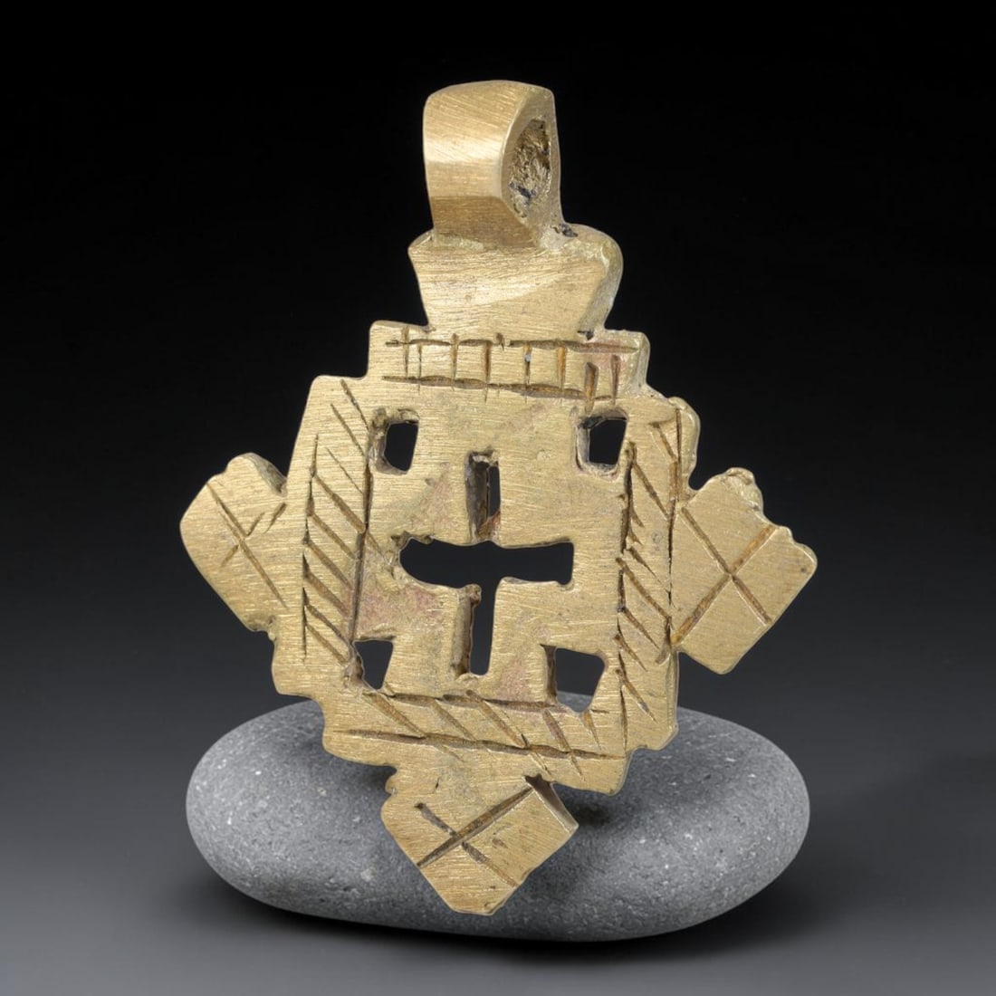 Vintage Ethiopian Copper Alloy Cross Pendant, 16EJ: Crafted from copper alloy, this traditional Ethiopian cross pendant features integrated suspension loop for wear. Shows authentic surface patina consistent with vintage origin. Dimensions: 4x3cm. Soli