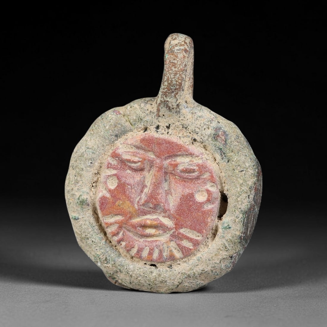 Ancient Medieval Byzantine Bronze Pendant With Stone Cameo (5001200 CE), 42EH: This antique circular bronze pendant originates from medieval Byzantine cultural tradition, set with an inset carved stone cameo and made to serve as a wearable protective personal amulet. The bronze 