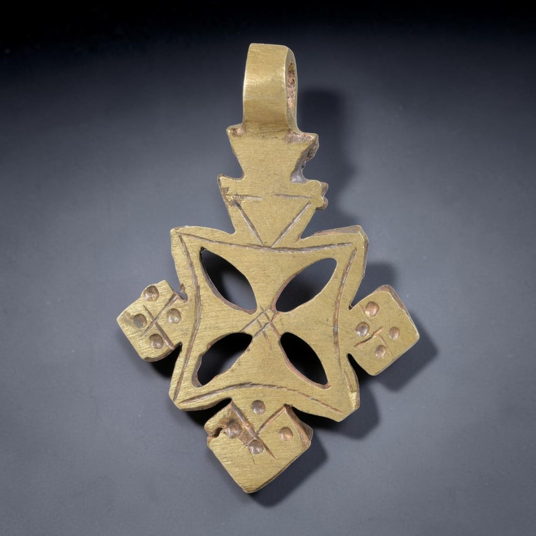Vintage Ethiopian Copper Alloy Cross Pendant, 23EJ: Crafted from copper alloy, this traditional Ethiopian cross pendant features integrated suspension loop for wear. Shows authentic surface patina consistent with vintage origin. Dimensions: 4.5x3cm. So