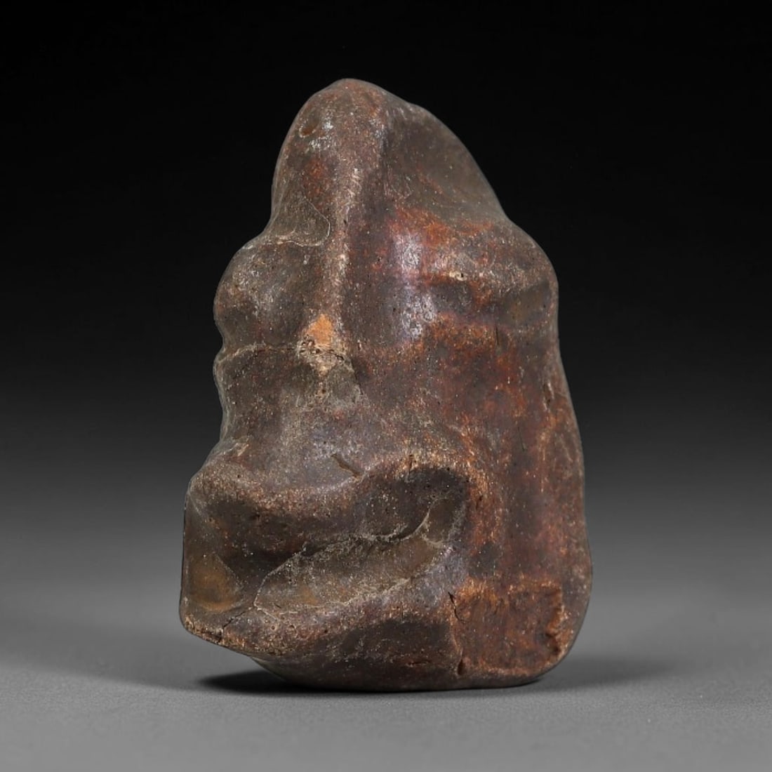 Ancient Medieval Mediterranean Hand Carved Stone Maskette Amulet, 35EJ: Miniature wearable sacred talisman hand hewn from natural soft stone, originating from Medieval Mediterranean cultural craft traditions. Small carved stone amulets were widespread personal artifacts a