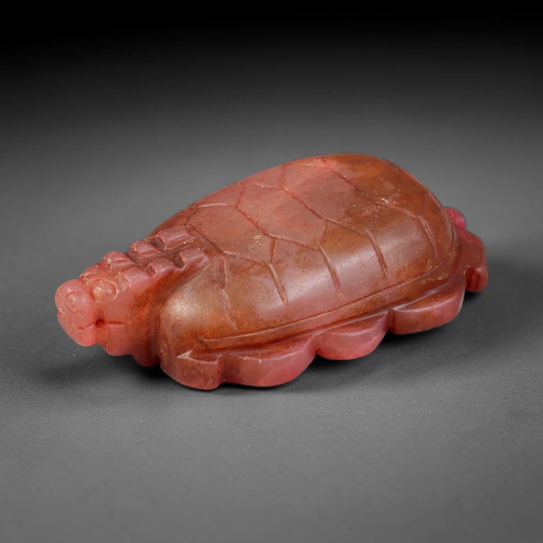 Ancient Medieval Carnelian Dragon-Turtle Zoomorphic Amulet, 75EF: This finely carved wearable amulet is fashioned from translucent carnelian, depicting a dragon-turtle hybrid form. Precise incised lines mark the segmented turtle shell, paired with a detailed dragon 