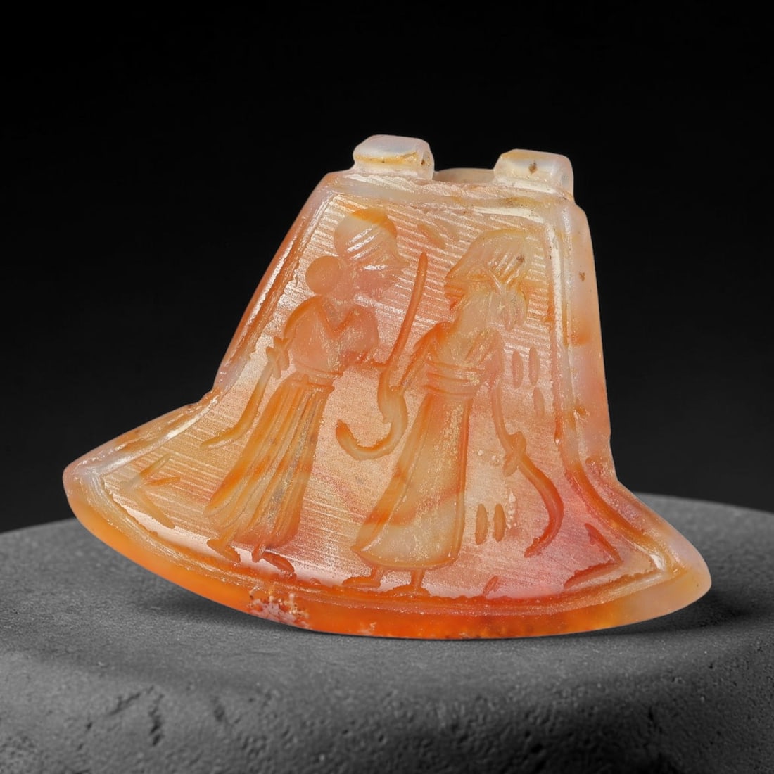 Vintage Natural Carnelian Agate Revival Indo-Persian Glyptic Figural Talisman Amulet Plaque, 45FK: This vintage talisman pendant plaque is skillfully carved from natural banded carnelian agate, crafted in a style referencing ancient Indo-Persian glyptic art traditions. The face bears detailed relie