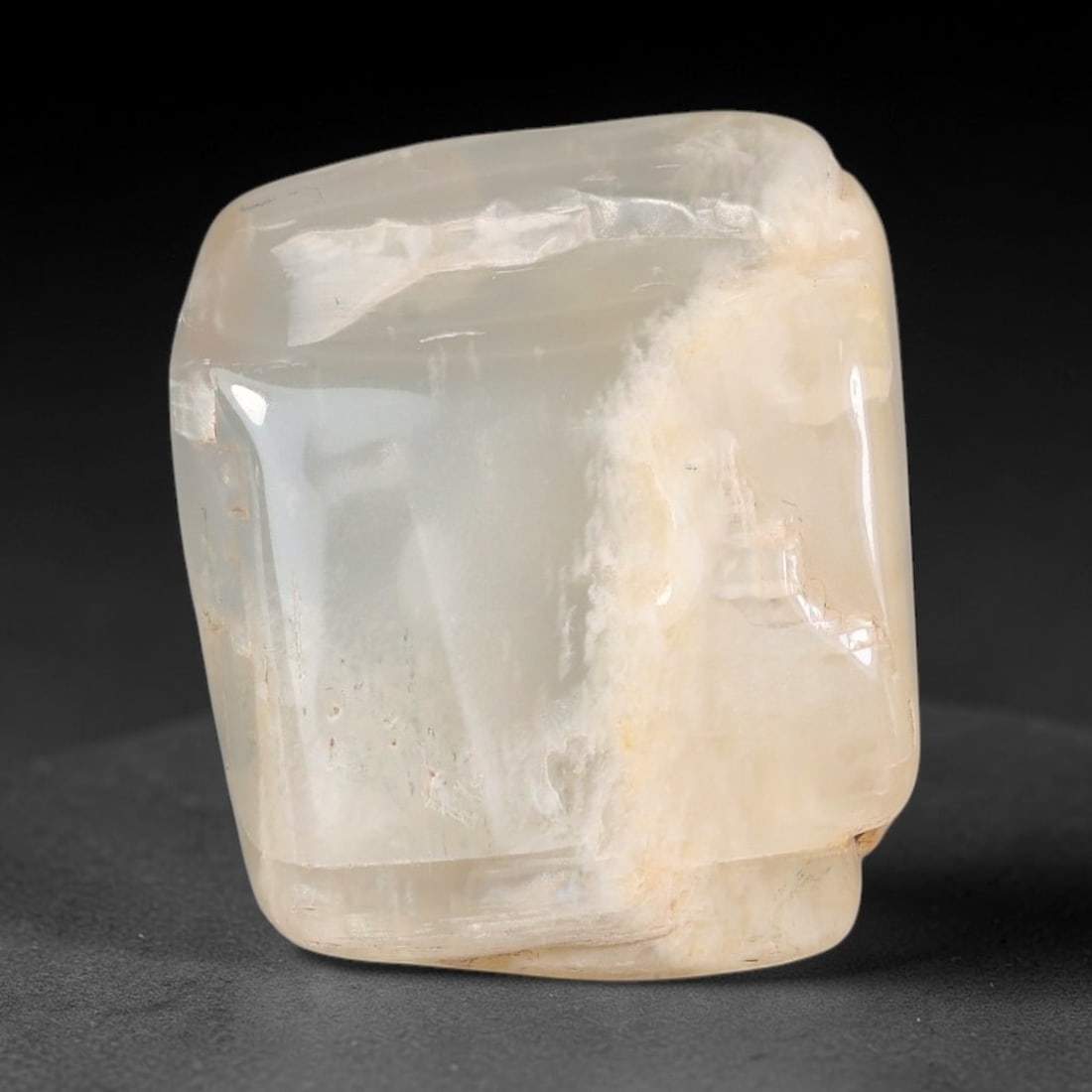 40ct Natural Ceylon Pale Cream White Moonstone Rough, 68AH: This smooth weathered moonstone rough carries soft pale cream white translucency with subtle internal silvery adularescent shimmer locked within its naturally tumbled surface, fine faint mineral veini