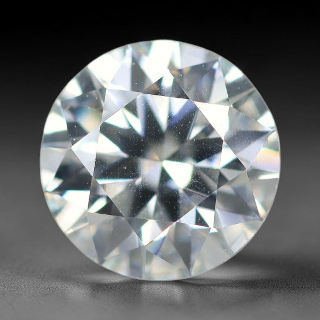1.20 Carats Natural Cool White Moissanite Loose Gemstone, 95FM: This cool white moissanite holds dimension measurements of 7x4.2mm, delivering exceptional light dispersion that generates vivid rainbow sparkle across its fully transparent body, with faint microscop