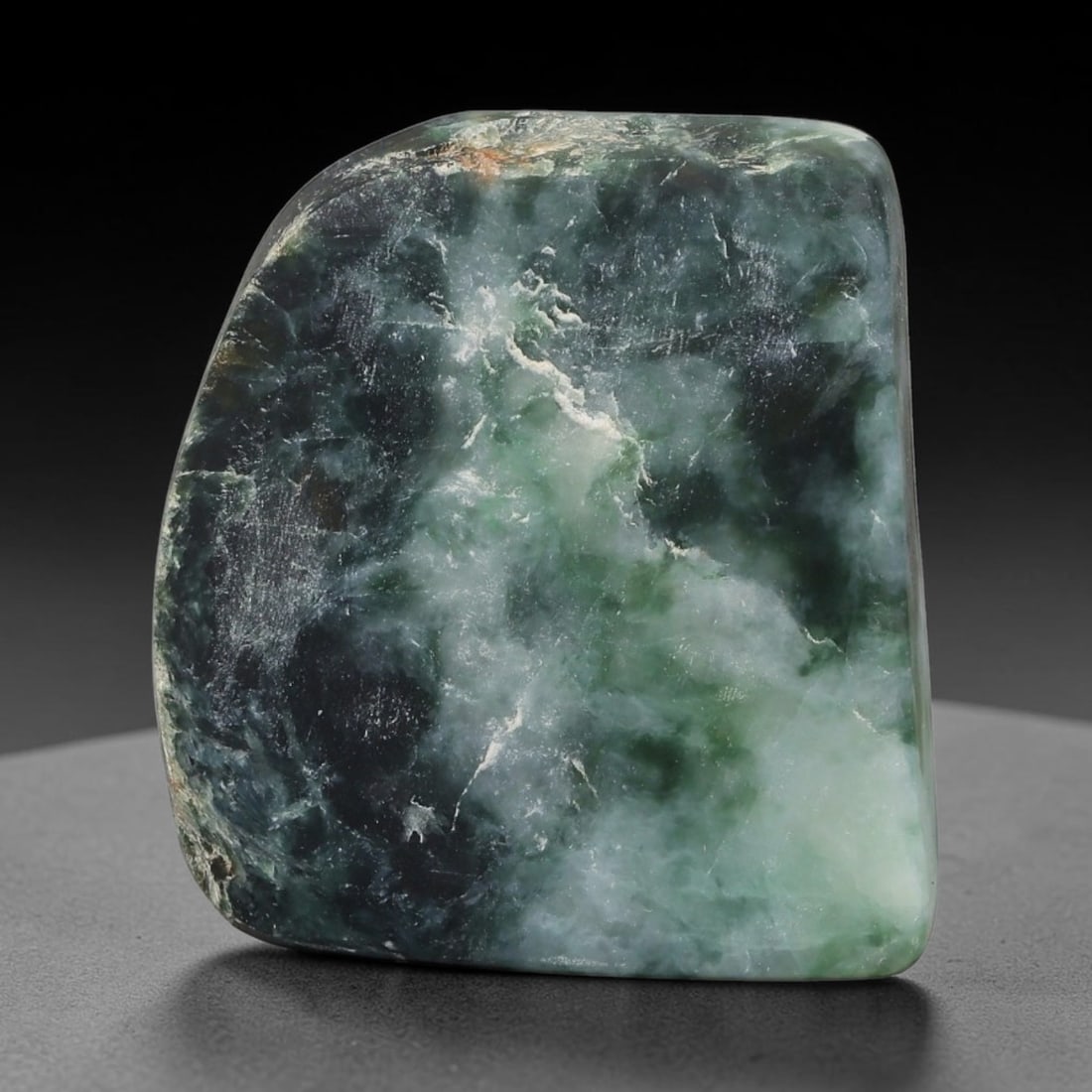 195ct Natural Type A Burmese Jadeite Jade Sliced Rough, 48FD: This specimen is a sliced rough block of natural Type A Burmese jadeite jade. The interior displays natural colour zoning with visible mineral veining and crystalline patterns typical of unprocessed j
