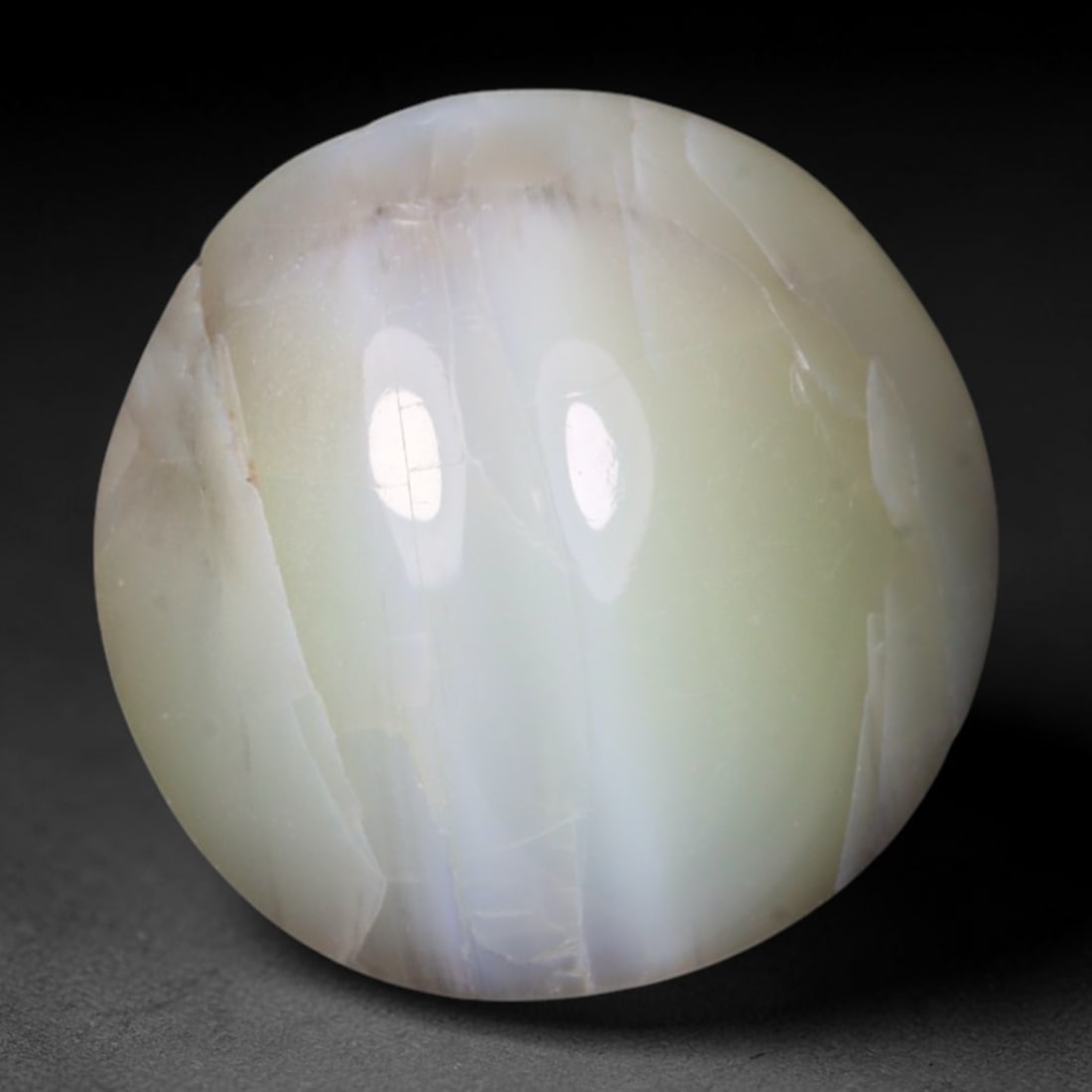 2.06 Carats Natural Ceylon Chrysoberyl Cat's Eye Loose Gemstone, 96AK: This polished Ceylon chrysoberyl cabochon displays a sharp, distinct silvery chatoyant band running across its smooth surface, formed by dense aligned microscopic rutile inclusions inherent to genuine
