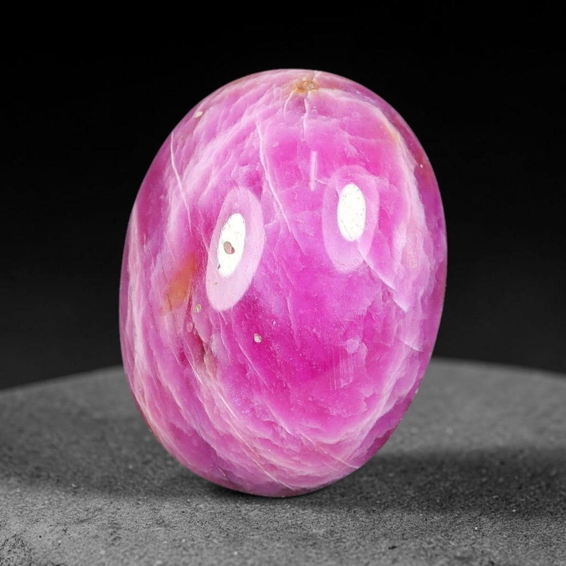 11.54 Carats Natural Mozambique Vivid Pink Red Ruby Loose Gemstone, 73FG: This polished Mozambique ruby cabochon measures 16.5x12.6x5.2mm, featuring striking natural swirling white mineral banding layered across a rich saturated pink red base that creates a unique organic a
