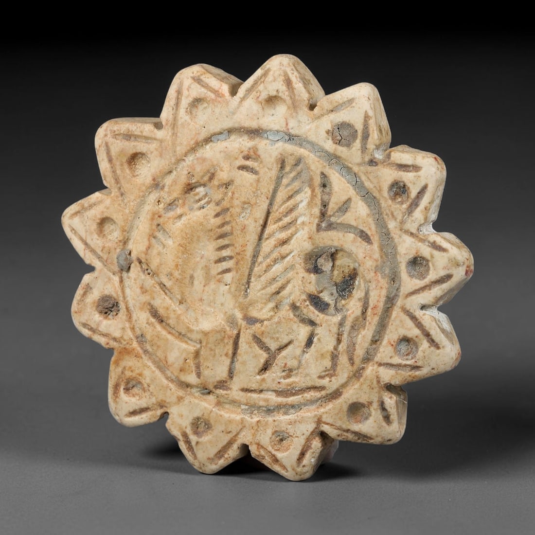 Ancient Neo-Hittite Stamp Seal (1200-800 BCE), 24EF: This ancient lobed star-form stamp seal is carved from pale marbled limestone, originating from Neo-Hittite civilizations of Eastern Anatolia and Northern Syria, cultures celebrated for distinctive po