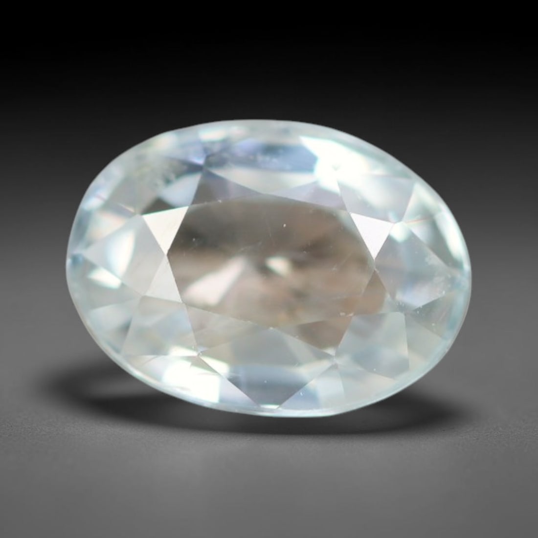 1.03ct Natural Cambodian White Zircon Loose Gemstone, 16BA: This fully polished Cambodian white zircon displays a crisp colorless transparent crystal body with faint microscopic mineral specks scattered within its high-refraction interior, measured at calibrat